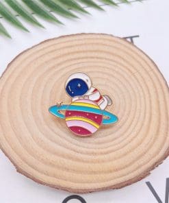 Alternative view of Astronaut 'Clasping Planet' Enamel Pin