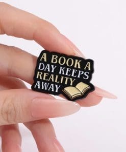 Alternative view of Book Lover 'A Book a Day Keeps Reality Away' Enamel Pin