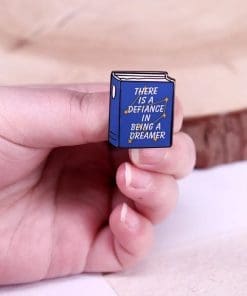 Alternative view of Addie LaRue Quote 'There Is A Defiance In Being A Dreamer' Enamel Pin